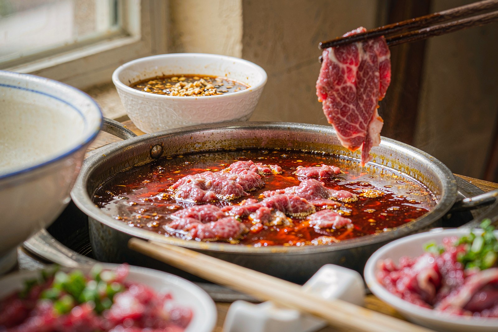 A bubbling Chaoshan beef hotpot with marbled beef