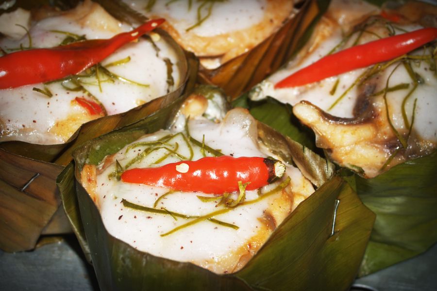 The fish head glistening in chili oil after steaming