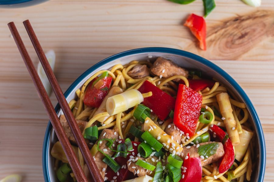 Thin slices of pork seared with green chilies in a wok