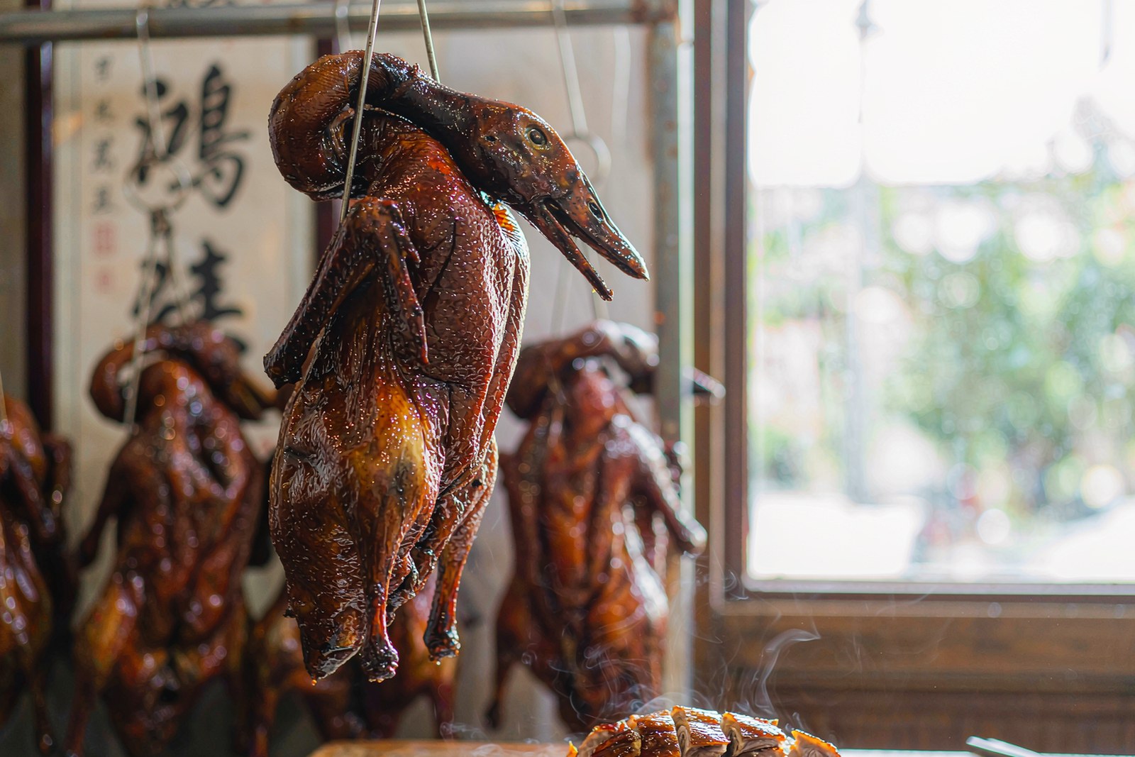 A glazed Cantonese roast goose with plum sauce