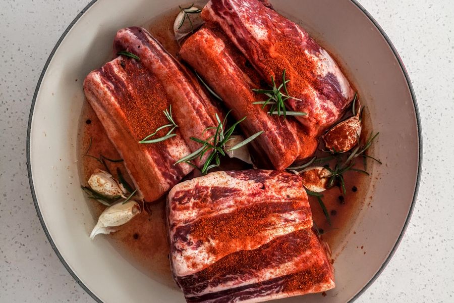 A plate of steamed cured meats served with rice