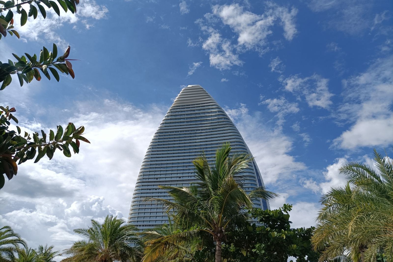The resort tower facing the sea with a beach in front
