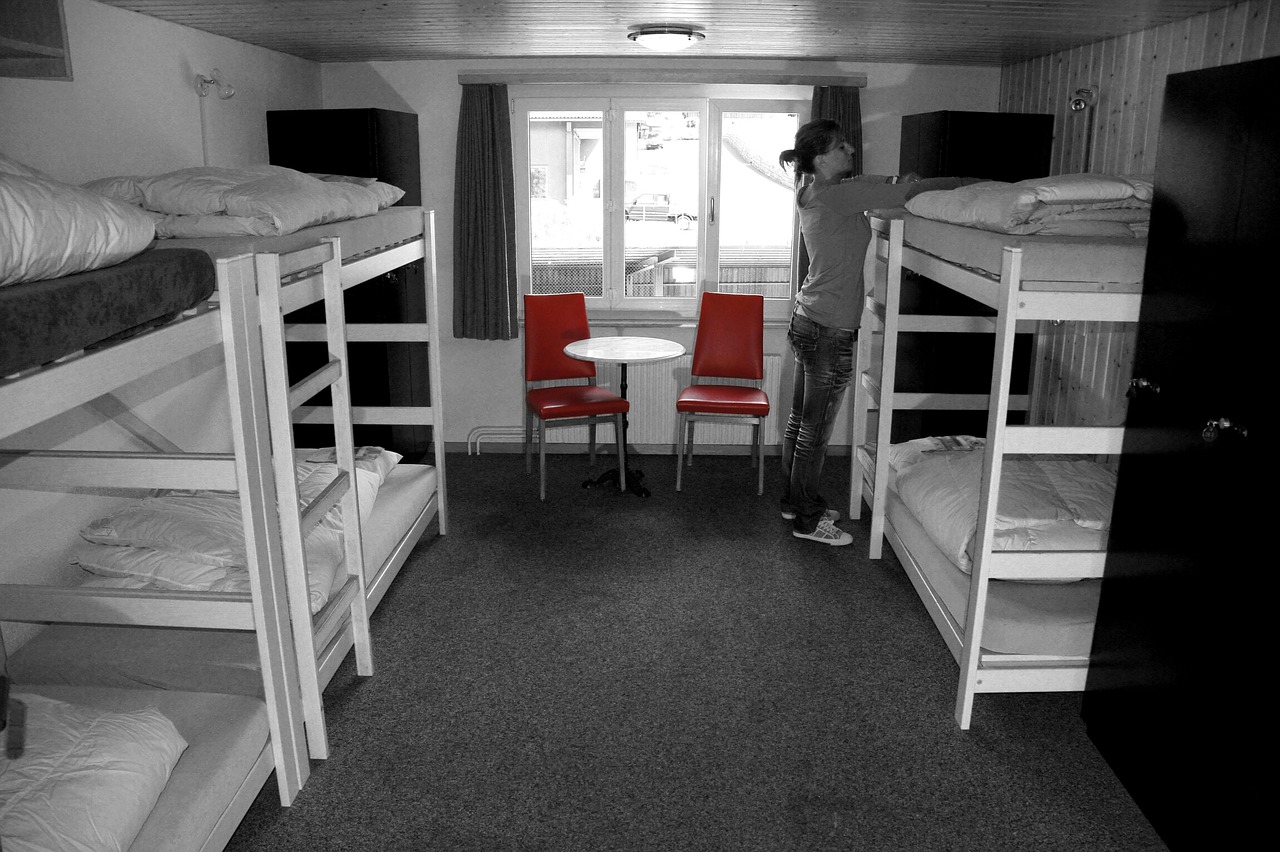 A quiet, tidy bunk room with river light through the window
