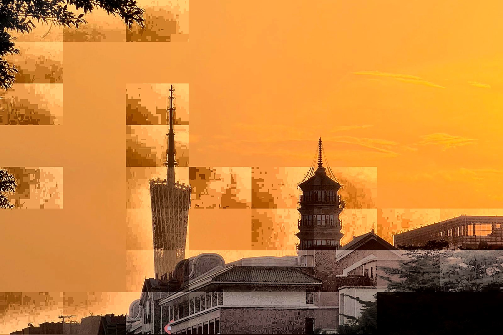 Canton Tower at sunset, the twisting steel tower rising above the Pearl River