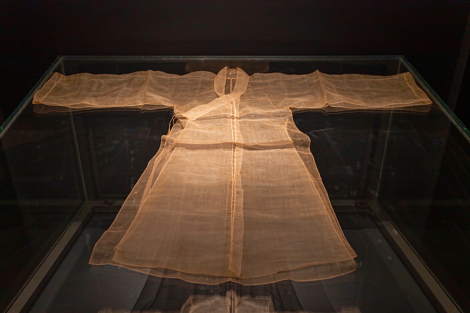 The 49-gram silk robe, lit in a dark case